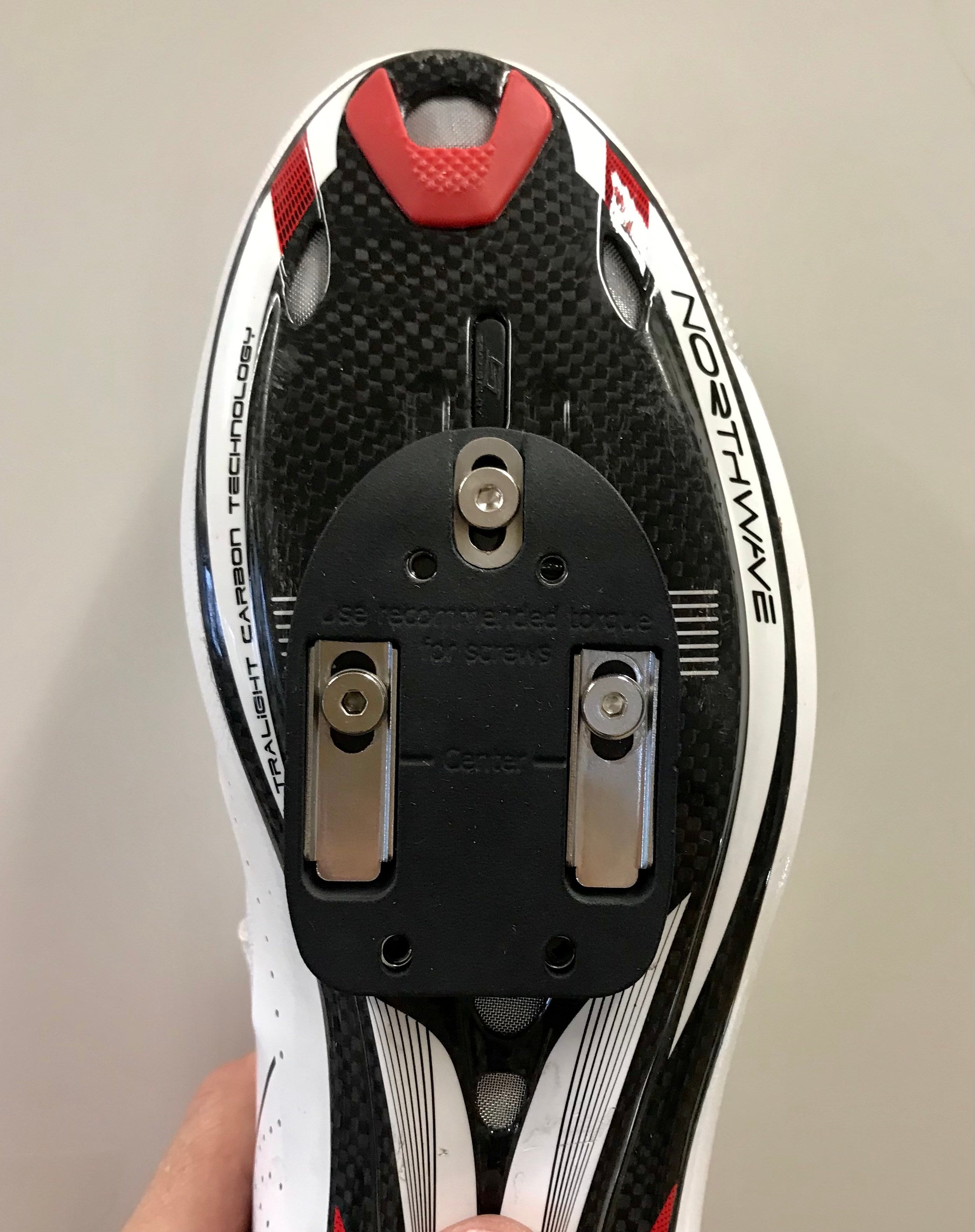 Cleat adapters for mortons neuroma, metatarsalgia, hot spots and other foot pain when cycling. Withoit cleat. Below cycling shoe.